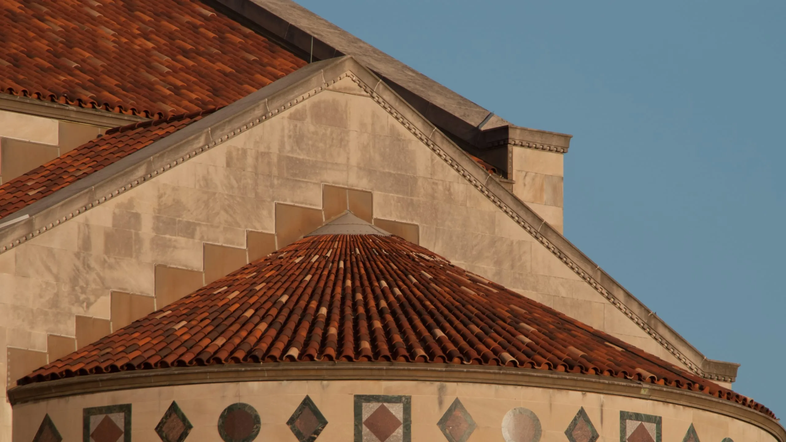 Close detail of the tiled dome and stonework at the National Basilica