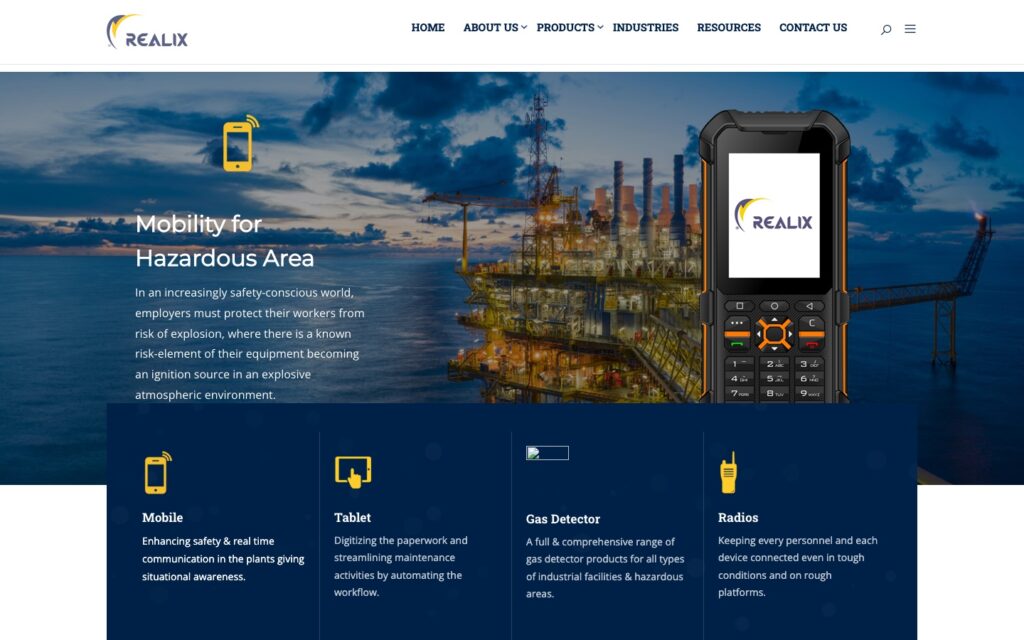 realix.co.uk in November 2025: a light page with an offshore platform photo, a keypad phone and four product category tiles